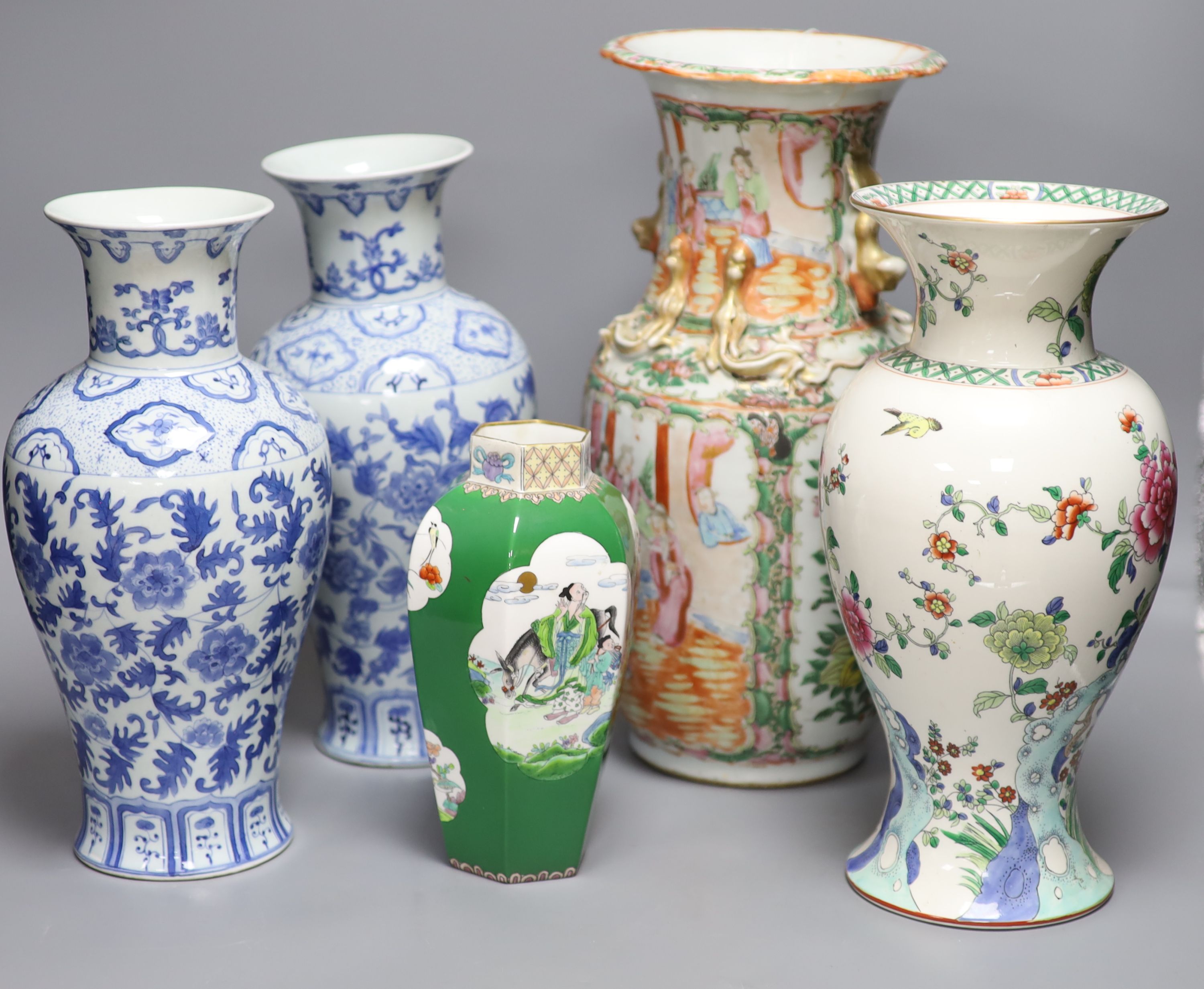 A Chinese famille rose Canton vase, a pair of blue and white vases and two others, tallest 35.5cm